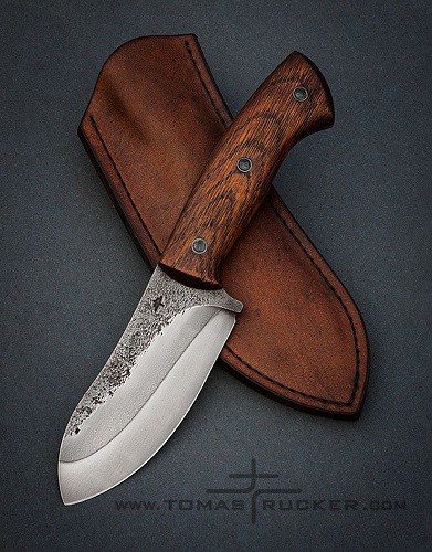 Full-tang Nessmuk knife with hamon and oak handle by Tomas TRMAN Rucker.